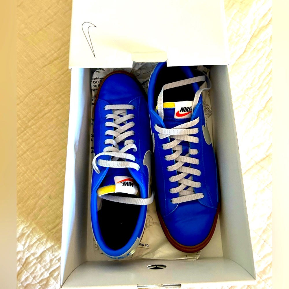 Men’s Nike.  Electric blue with silver swoosh.  Size 12.5